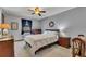Bedroom features carpet floors, a ceiling fan, and a beautiful view of the yard outside at 2731 Tritt Springs Ne Dr, Marietta, GA 30062