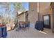 View of the home's outdoor deck with table, chairs, and grill, perfect for entertaining at 2731 Tritt Springs Ne Dr, Marietta, GA 30062