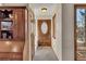 Inviting entryway with stone floors, a stained wood door with sidelight, and built-in storage at 2731 Tritt Springs Ne Dr, Marietta, GA 30062