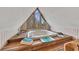 Cozy jacuzzi on the third floor featuring a large triangular window with a wood frame and wood floor at 2731 Tritt Springs Ne Dr, Marietta, GA 30062