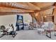 Spacious living room featuring wood beamed ceilings, carpeted floors, comfortable seating and natural light at 2731 Tritt Springs Ne Dr, Marietta, GA 30062