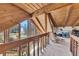 A large living room boasting wood-beamed ceilings, big windows, a railing and comfortable seating at 2731 Tritt Springs Ne Dr, Marietta, GA 30062