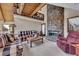 Charming living room featuring a stone fireplace, a beamed ceiling and wood accents at 2731 Tritt Springs Ne Dr, Marietta, GA 30062