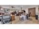 Spacious living room with hardwood floors, a window bench, an office, and comfortable leather furniture at 2731 Tritt Springs Ne Dr, Marietta, GA 30062