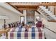 Cozy living room showcasing a striking stone fireplace, plush seating, and natural light at 2731 Tritt Springs Ne Dr, Marietta, GA 30062