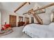 Bright main bedroom features carpet floors, a high vaulted ceiling with wooden beams, and a sleeping loft at 2731 Tritt Springs Ne Dr, Marietta, GA 30062