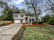 Charming split-level home with front porch and a well-maintained front yard at 3783 Red Rose Ct, Loganville, GA 30052