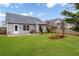 Backyard with patio, green lawn, wood fence and tasteful landscaping at 521 Gardenview Rd, Canton, GA 30114