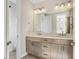 Bathroom featuring a double sink vanity with updated lighting and fixtures at 264 Castleberry Station Sw Dr, Atlanta, GA 30313