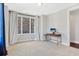 Neutral bedroom featuring natural lighting, carpet, and a desk at 264 Castleberry Station Sw Dr, Atlanta, GA 30313