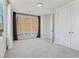Bright bedroom features large windows with curtains and a spacious double door closet at 264 Castleberry Station Sw Dr, Atlanta, GA 30313