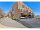 Brick townhomes featuring private balconies and attached garages with professional landscaping at 264 Castleberry Station Sw Dr, Atlanta, GA 30313