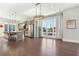 Open kitchen features modern island with seating, pendant lights, and stainless appliances at 264 Castleberry Station Sw Dr, Atlanta, GA 30313