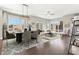 Open-concept living and dining area with hardwood floors and lots of natural light at 264 Castleberry Station Sw Dr, Atlanta, GA 30313