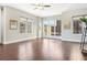 Spacious living room features gleaming hardwood floors, large windows, and neutral walls at 264 Castleberry Station Sw Dr, Atlanta, GA 30313
