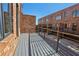 Spacious deck with metal railing and view of brick exterior at 264 Castleberry Station Sw Dr, Atlanta, GA 30313