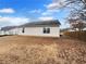 Spacious backyard featuring a well-maintained lawn and fenced perimeter, perfect for outdoor activities at 328 Village Ln, Stockbridge, GA 30281
