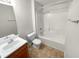 Bathroom featuring a vanity, sink, toilet, and tub-shower combination at 328 Village Ln, Stockbridge, GA 30281