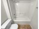 Bathroom featuring a toilet and tub-shower combination at 328 Village Ln, Stockbridge, GA 30281