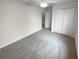 Bright bedroom with neutral carpet, ceiling fan, and closet with folding doors at 328 Village Ln, Stockbridge, GA 30281