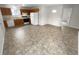 Functional kitchen with wooden cabinets, standard appliances, and durable flooring at 328 Village Ln, Stockbridge, GA 30281