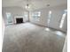 Spacious living area with a fireplace and access to the outdoors at 328 Village Ln, Stockbridge, GA 30281