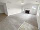 Spacious living room with neutral decor and a fireplace, offering a welcoming atmosphere at 328 Village Ln, Stockbridge, GA 30281
