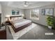 A cozy main bedroom with a plush bed, stylish decor, and bright natural light at 328 Village Ln, Stockbridge, GA 30281