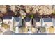 Birds eye view of homes in a suburban community with tree-lined streets and manicured lawns at 6674 Mimosa Cir, Tucker, GA 30084