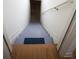 Staircase to basement with handrail on wall and finished floor landing at 6674 Mimosa Cir, Tucker, GA 30084