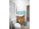 Small bathroom featuring a sink and toilet, with a decorative mirror at 6674 Mimosa Cir, Tucker, GA 30084