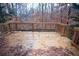 A spacious wooden deck shows off natural surroundings and wood railings at 6674 Mimosa Cir, Tucker, GA 30084