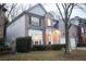 A charming two-story house with brick accents, complemented by lush landscaping and a welcoming entrance at 6674 Mimosa Cir, Tucker, GA 30084