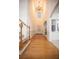 Grand foyer featuring gleaming hardwood floors, soaring ceilings, and elegant chandelier at 6674 Mimosa Cir, Tucker, GA 30084