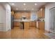 Bright eat-in kitchen boasts wooden cabinetry and stainless steel appliances at 6674 Mimosa Cir, Tucker, GA 30084