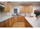 Kitchen with wood cabinets, an island, a window over the sink and wood flooring at 6674 Mimosa Cir, Tucker, GA 30084