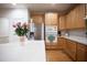 Bright kitchen features wooden cabinetry and stainless steel appliances at 6674 Mimosa Cir, Tucker, GA 30084