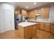 Modern eat-in kitchen featuring wooden cabinetry, stainless appliances and lots of natural light at 6674 Mimosa Cir, Tucker, GA 30084