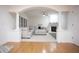 Open-concept living space with hardwood floors and fireplace at 6674 Mimosa Cir, Tucker, GA 30084