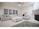 Comfortable living room featuring neutral decor, large windows and a fireplace at 6674 Mimosa Cir, Tucker, GA 30084