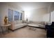 Inviting living area featuring neutral decor, comfortable seating, and large windows at 6674 Mimosa Cir, Tucker, GA 30084