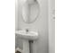 Pedestal sink bathroom with neutral wall color at 4878 Hairston Park Sq, Stone Mountain, GA 30083