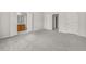 Spacious bedroom with neutral carpet and ensuite bathroom entrance at 4878 Hairston Park Sq, Stone Mountain, GA 30083