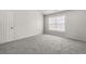 Features plush grey carpeting and natural light at 4878 Hairston Park Sq, Stone Mountain, GA 30083