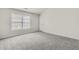 Bedroom with neutral carpet, ample natural light and large windows at 4878 Hairston Park Sq, Stone Mountain, GA 30083