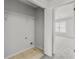 Walk-in closet with white wire shelving and adjacent room view at 4878 Hairston Park Sq, Stone Mountain, GA 30083