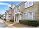 Charming townhomes feature brick exteriors, inviting front porches, and well-maintained landscaping at 4878 Hairston Park Sq, Stone Mountain, GA 30083