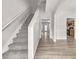 Spacious hallway with stairs, featuring sleek modern flooring and neutral paint at 4878 Hairston Park Sq, Stone Mountain, GA 30083