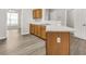 Shows light countertops, wood cabinets, and wood-look laminate flooring at 4878 Hairston Park Sq, Stone Mountain, GA 30083