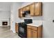 Shows a gas range and matching wood cabinets and laminate countertops at 4878 Hairston Park Sq, Stone Mountain, GA 30083